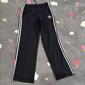 Adidas Black and White Sweatpants with Iconic Stripes